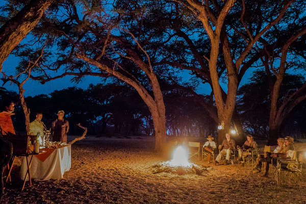 Riders around the bonfire in Hwange