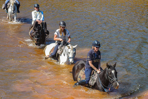 Riders crossing a river in South Africa
