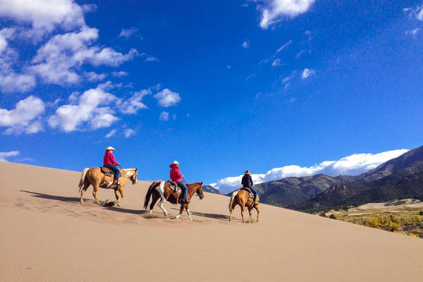 Riders in the Great Sand Dunes National Park, Colorado