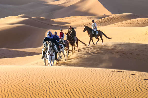 Riders in the sand dunes