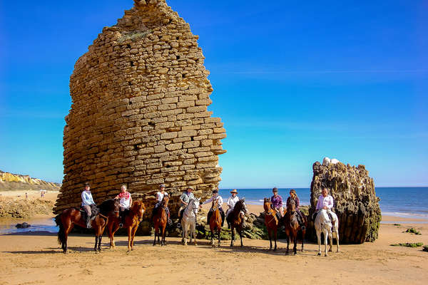 Riders on a beach ride in Spain