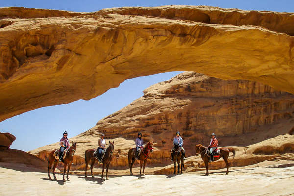 Riders posing for a picture in Jordan