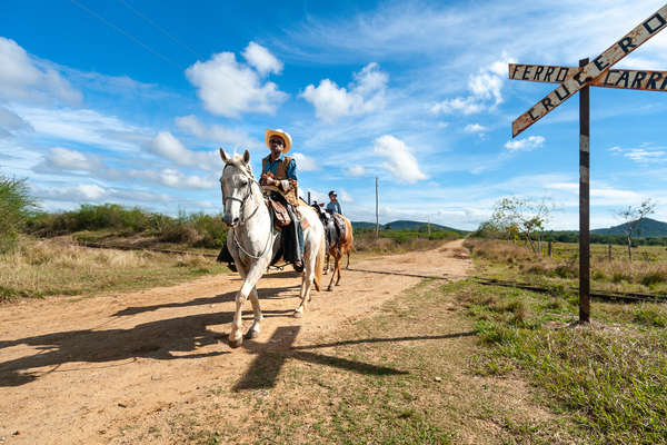 Riders riding along a trail in Cuba