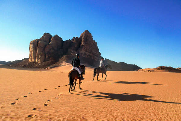 Riders riding along the desert in Jordan