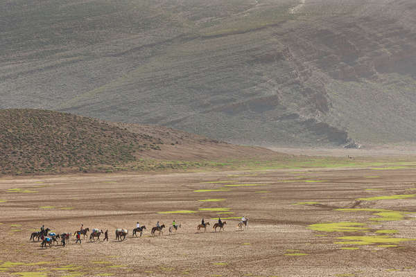 Riders riding close to the High Atlas Mountains