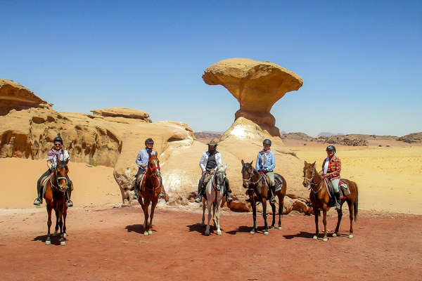 Riders taking a break in the middle of the desert in Jordan
