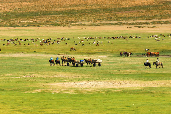 Riding across the steppe in Mongolia