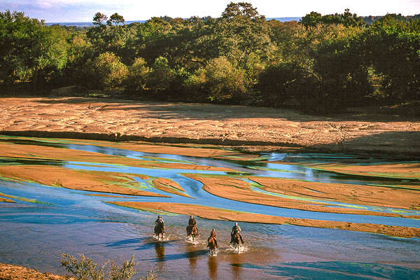 Riding into the Limpopo river, Botswana