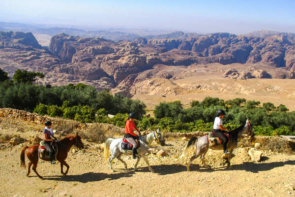 Three riders riding along a trail in Jordan