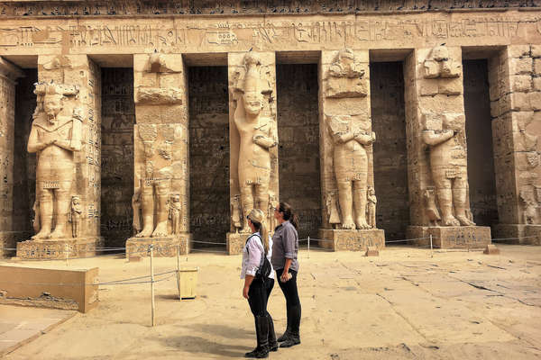 Two people exploring a landmark in Egypt