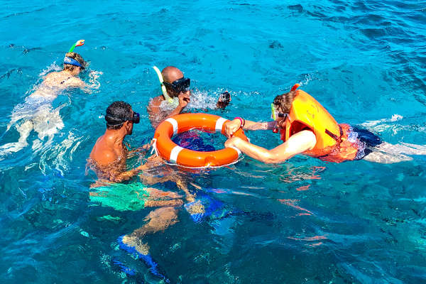Visitors swimming in the red sea