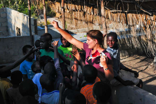 Woman surrounded by children in Mozambique