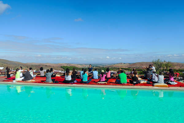 Yoga by the pool at Terres d'Amanar