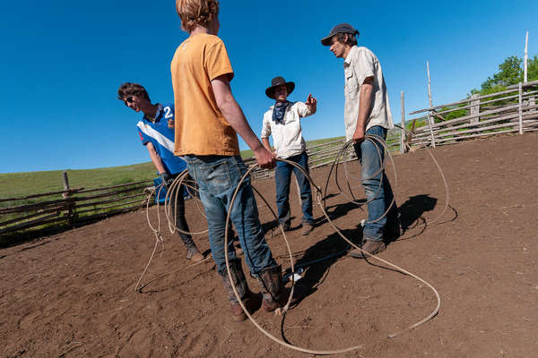 Young boys learning to rope at TX ranch