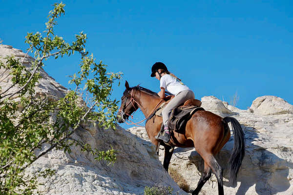 Young rider on horseback in Turkey, Cappadocia